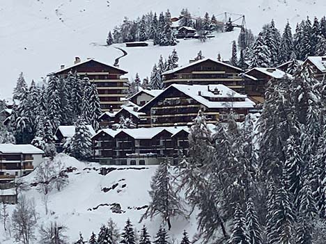 View of Chalet in Verbier through the snow covered trees