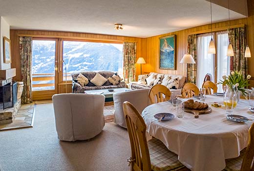 Chalet in Verbier open plan lounge and dining area with view over mountains