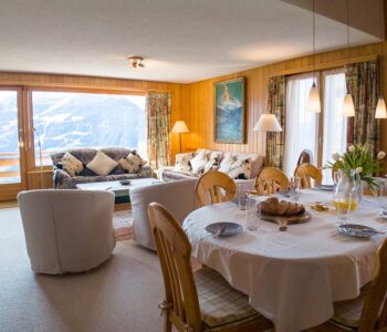 View from dining area to open plan lounge and balcony views